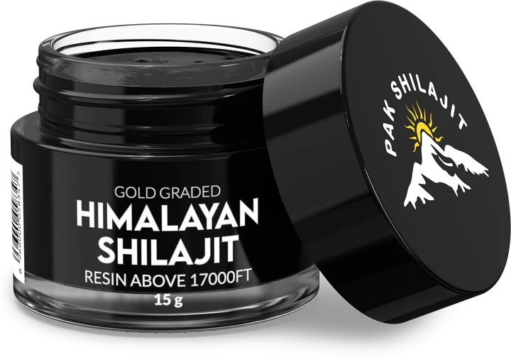 Open jar of gold-grade Himalayan shilajit resin with the steel spatula resting in the lid