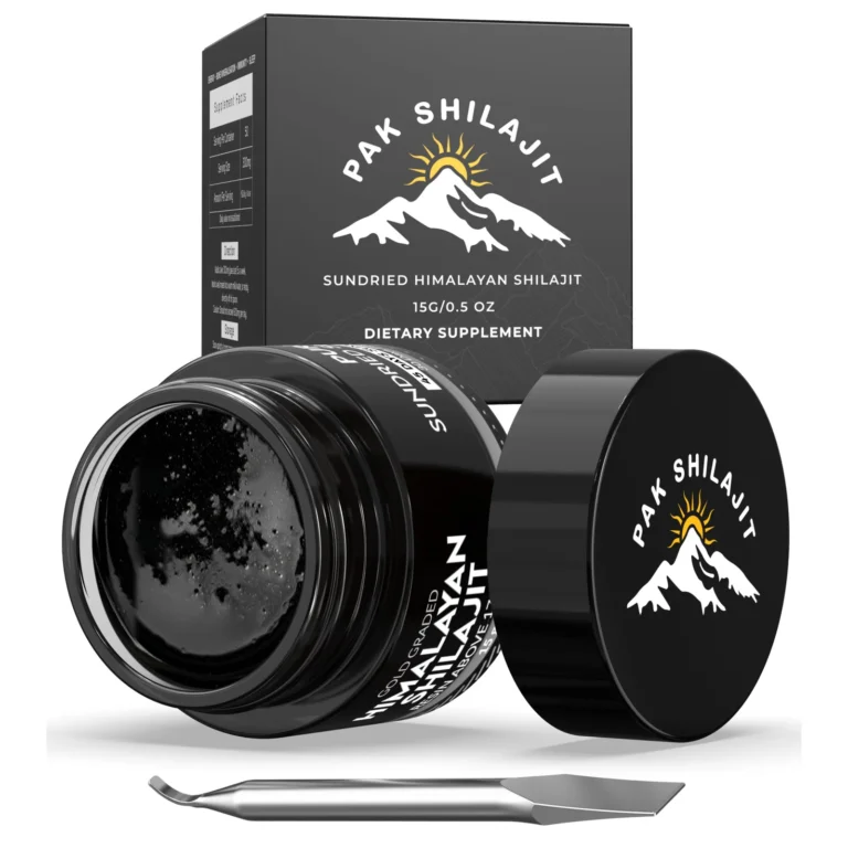 Open jar of gold-grade Himalayan shilajit resin with the steel spatula resting in the lid
