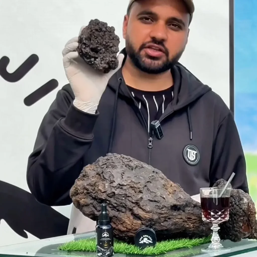 Pak Shilajit founder holding raw unpurified shilajit