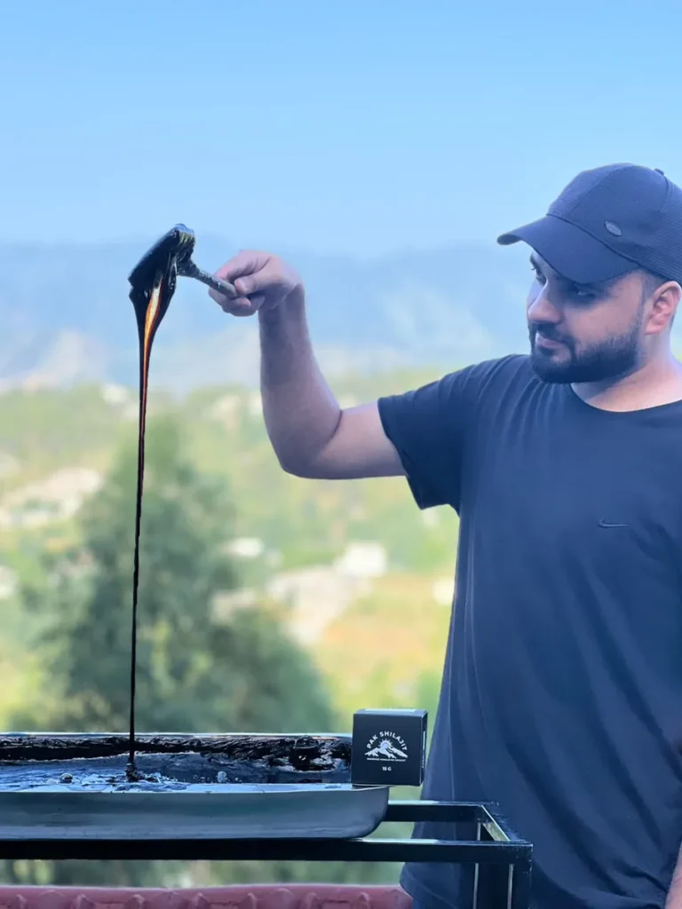Bilawal Gul pulling resin at the drying site